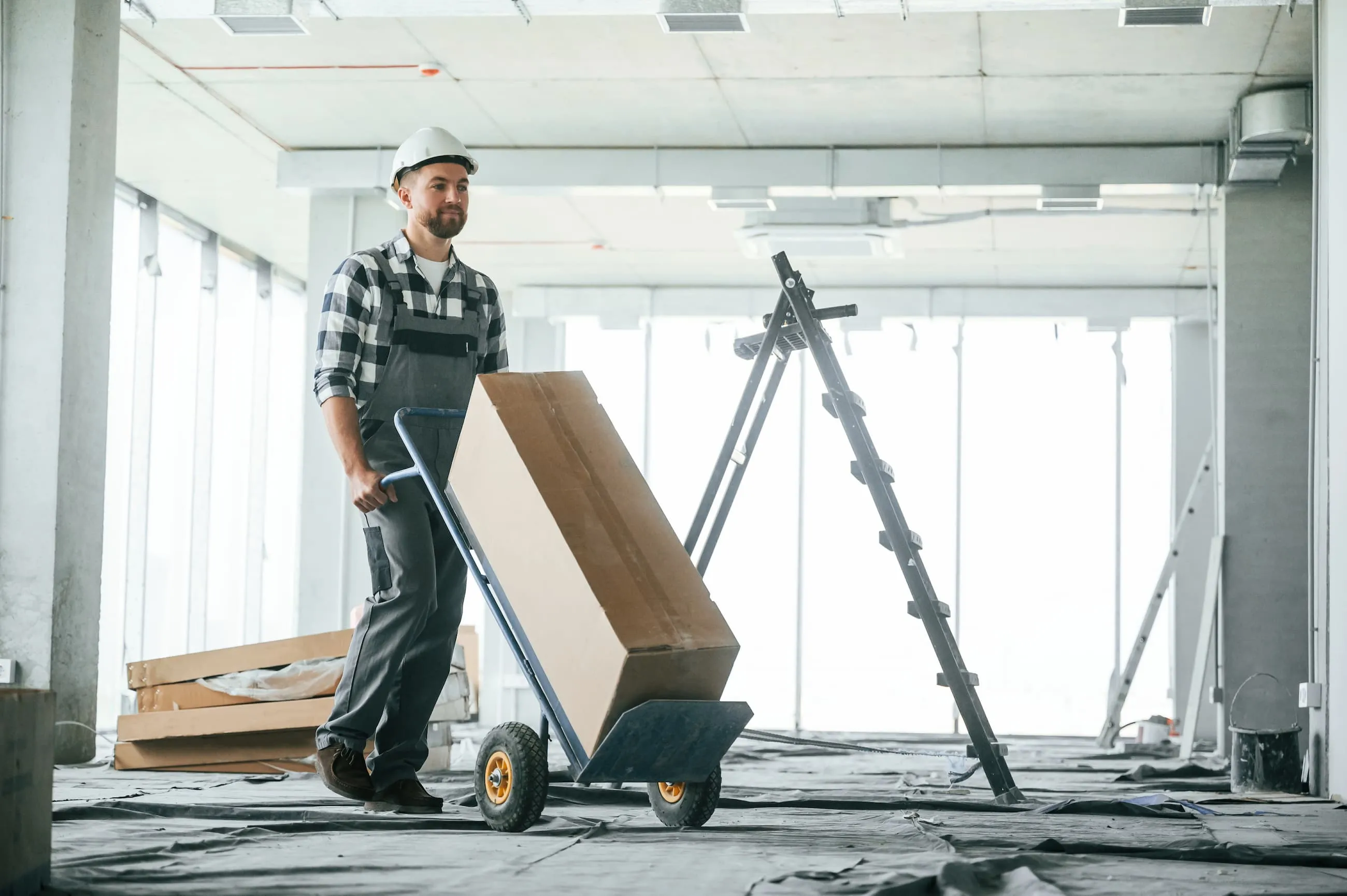 A man using a moving dolly.